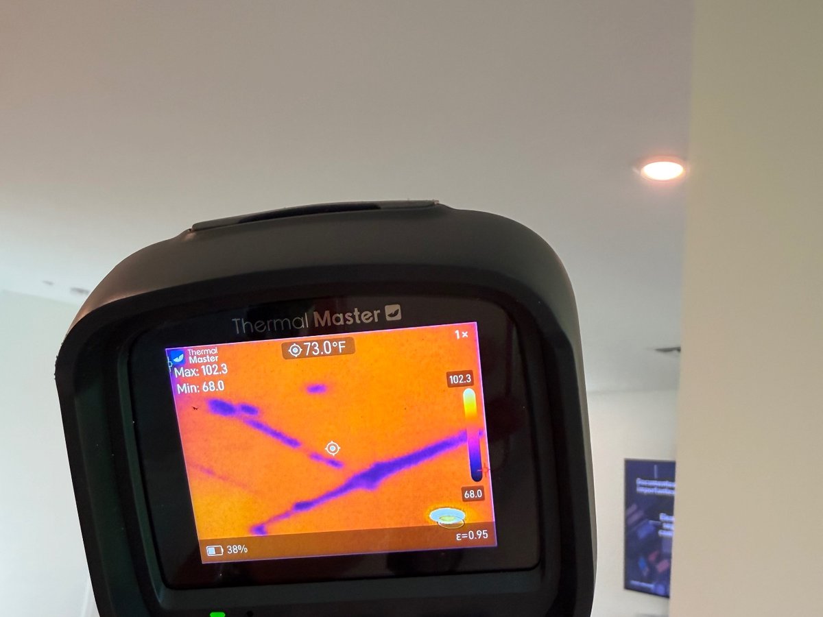 Thermal camera display documenting a temperature anomaly on an interior ceiling during an inspection